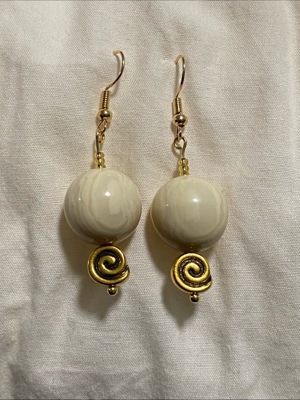 Cream Bead Drop Earrings with Gold Spiral Accent